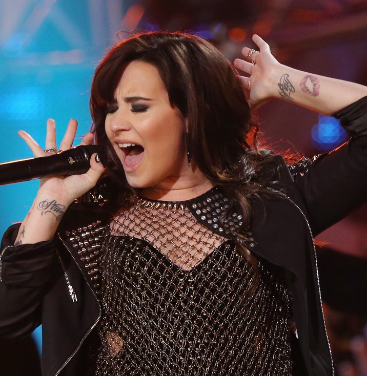 Demi Lovato' Tattoos - Artistic Design Tattoo on Forearm