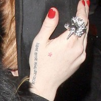 Lindsay Lohan Tattoos - Female Wrist Lettering Tattoo