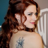 Alexandra Breckenridge's Tattoos - Lettering Tattoo on Upper Back