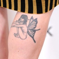 Alexandra Breckenridge's Tattoos - Wings Tattoo on Leg