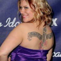 Erika Van Pelt's Tattoos - Artistic Design Tattoo on Upper Back