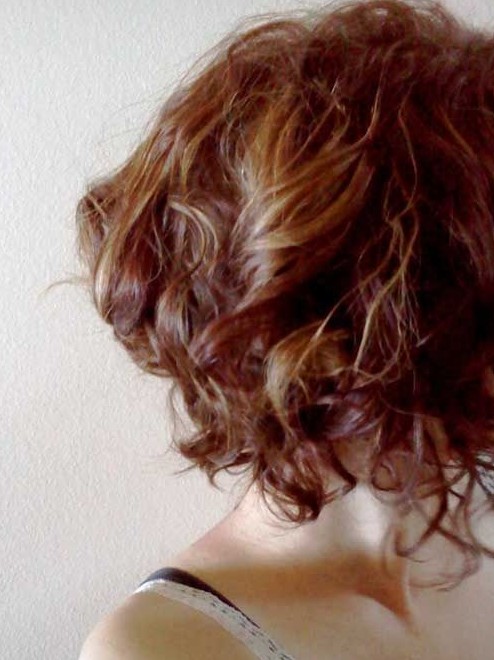 Side View of Chic Highlighted Short Curly Hairstyle