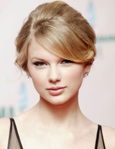 Taylor Swift Hairstyles: Blonde Graceful Updo with Bangs
