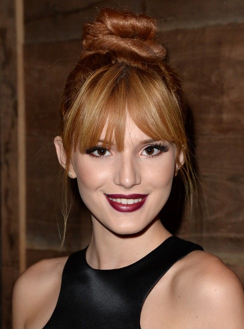 Bella Thorne Long Hairstyle: Twisted Bun with Bangs