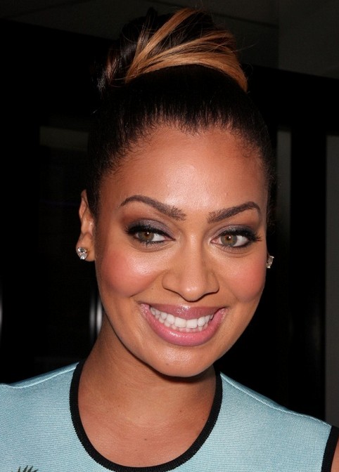 La La Anthony Long Hairstyle: Classic Bun with Highlights