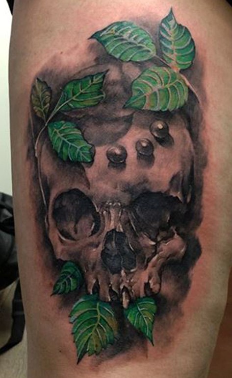Leaf and skull tattoo