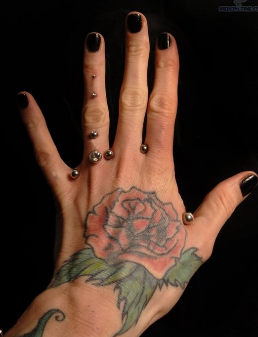 Rose tattoo on hand: Women tattoos
