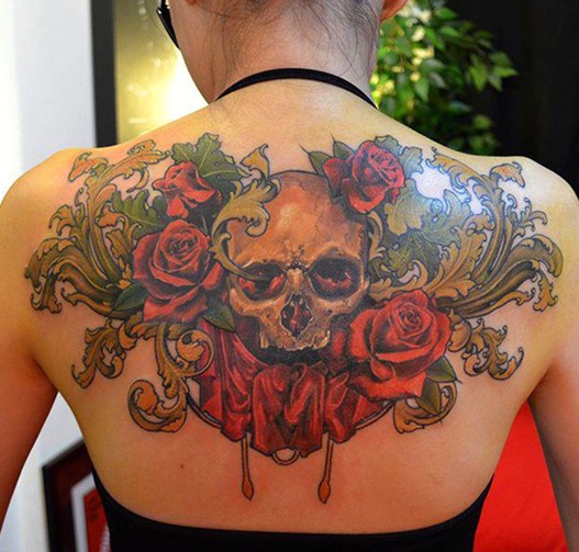 Skull and roses tattoo on black