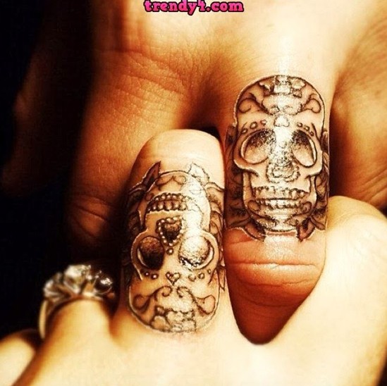 Small skull tattoo designs on fingers