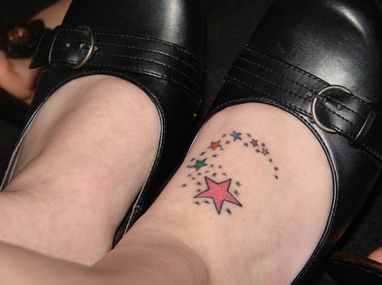 Star Tattoo Designs: Colorful shooting stars on the foot