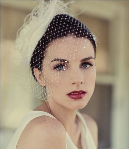 The Vintage Updo Wedding Hairstyle with a Beaded Birdcage Net Hat