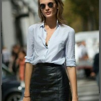 Black leather below-the-knee skirt and button down shirt