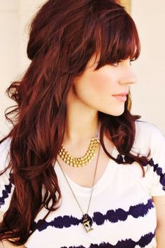 Dark Red Wavy Hairstyle With Blunt Bangs