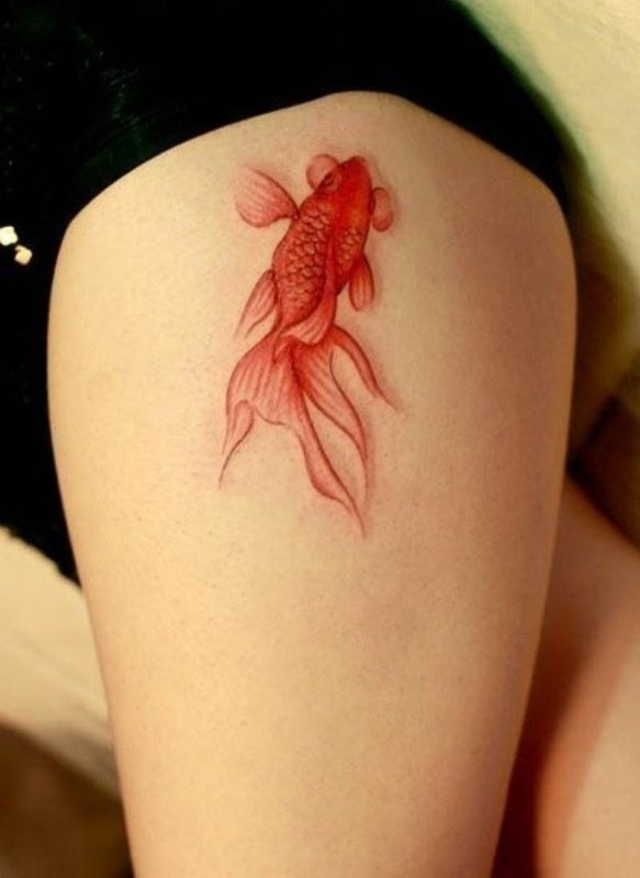 Pretty Golden Fish Tattoo on the Thigh