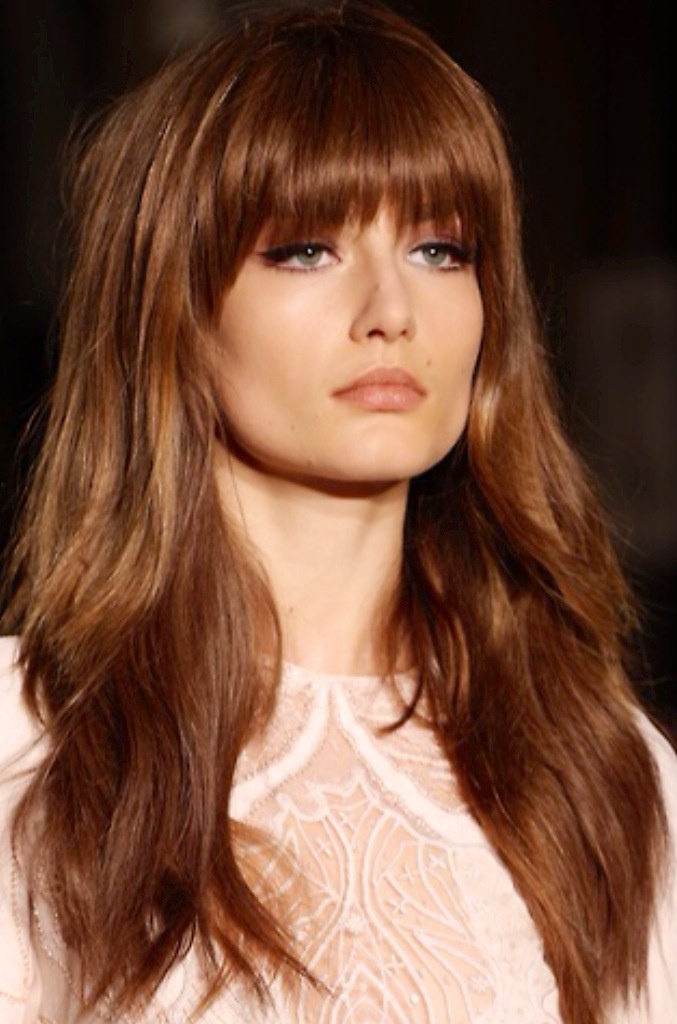 Long Layered Hairstyle With Soft Bangs