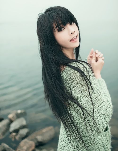 Long Layered Black Hairstyle With Blunt Bangs