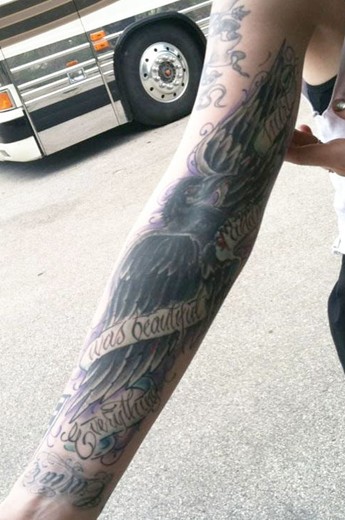 Ash Costellos tattoos – black crow right arm sleeve