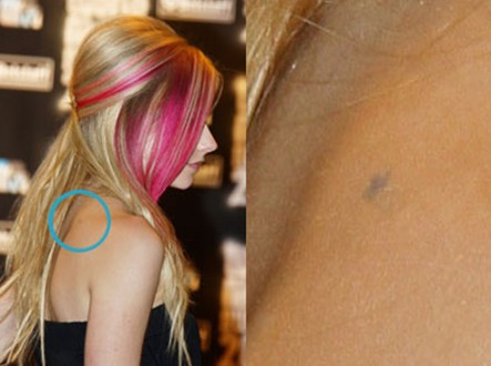 Avril Lavigne tattoos - tiny star tattoo on back