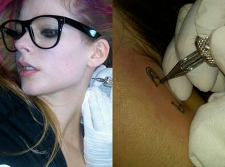 Avril Lavigne tattoos – safety-pin on neck