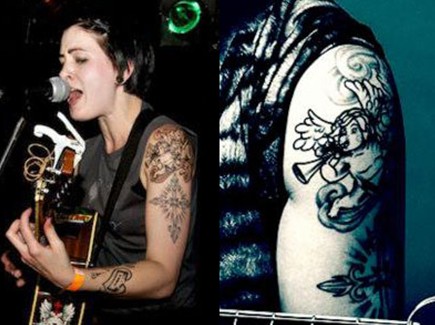 Beth Lucas tattoos – cherub on upper left arm