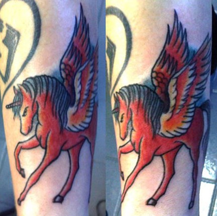 Beth Lucas tattoos – red unicorn by Ash Against