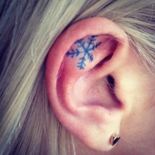 Snowflake Inner Ear Tattoo