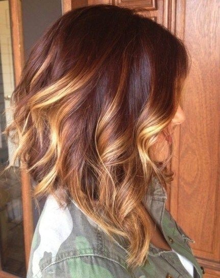 Medium Layered Hairstyle with Blond Highlights