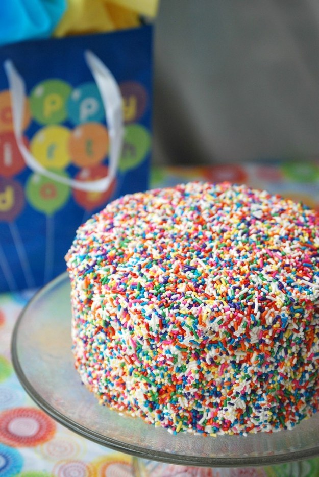 Coat a cake with sprinkles