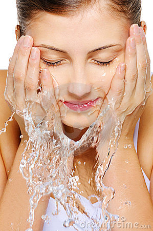 cute-woman-wash-her-face-water-11429879