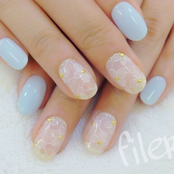 Pale Blue Nails with White Flowers via