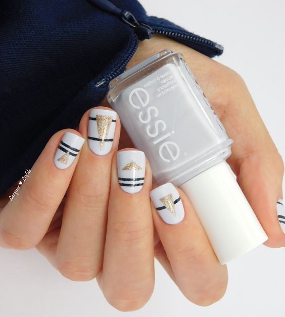 White Nails with Black Strips and Glitter Triangles via