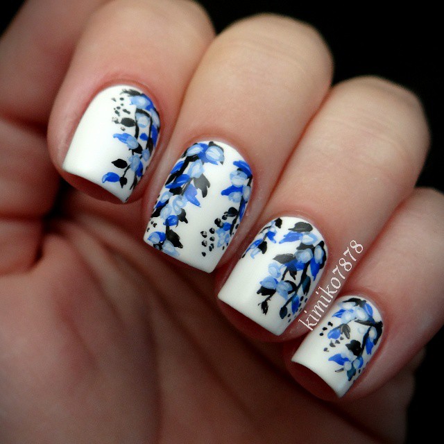 White Nails with Blue Flowers via