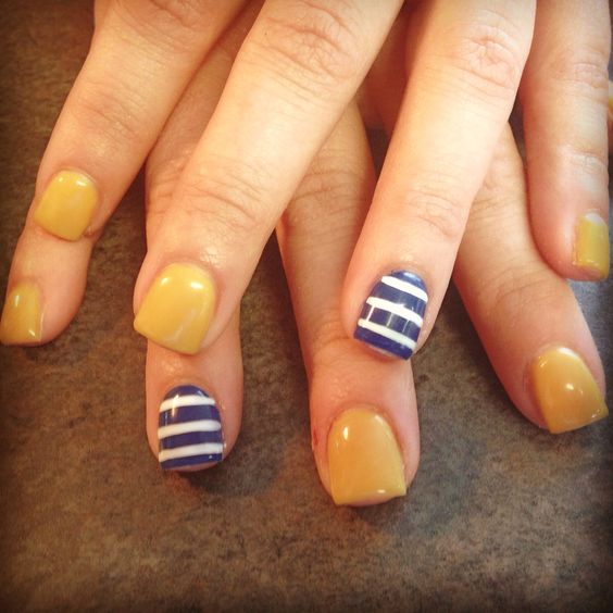 mustard-nails-with-blue-and-white-lines via