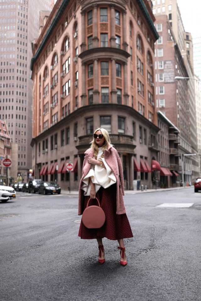 pink-coat-white-top-and-red-skirt via