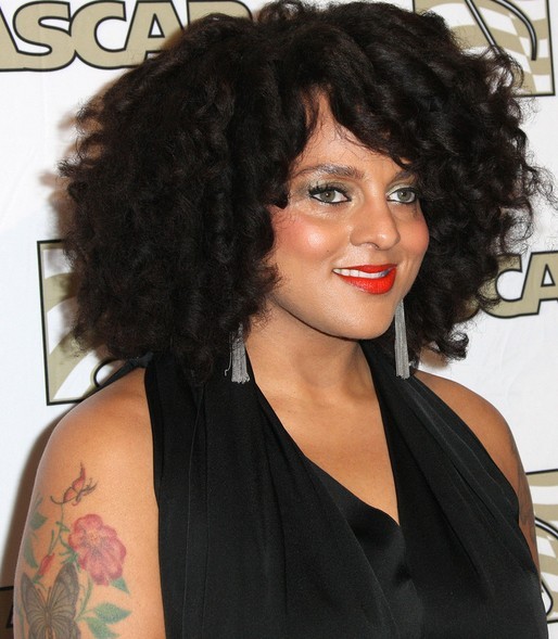 Marsha Ambrosius' Tattoos - Flower Tattoo on Upper Arm