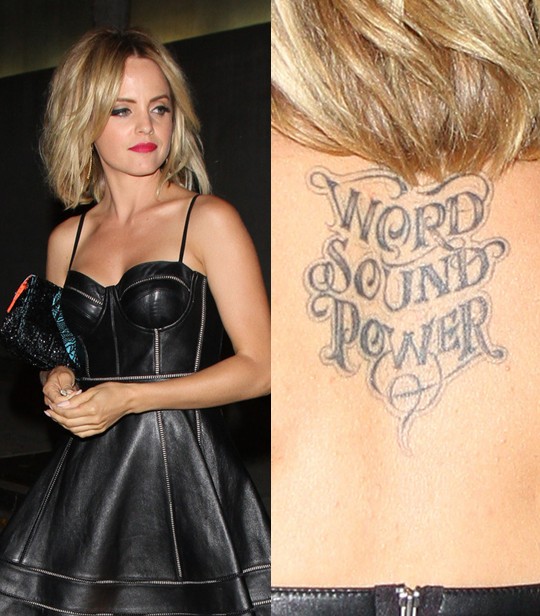 Mena Suvari' Tattoos - Upper Back Lettering Tattoo