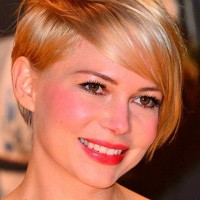 Michelle Williams Short Haircut: Asymmetrical Long Blond Pixie Cut with Side Bangs