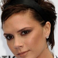 Victoria Beckham Short Haircut：Chopped Shaggy Brown Pixie Hair with Asymmetrical Parting