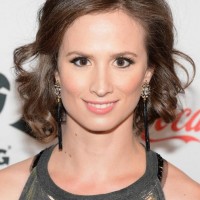 Katherine DuBois' Short Curly Hairstyle: Brown And Bright