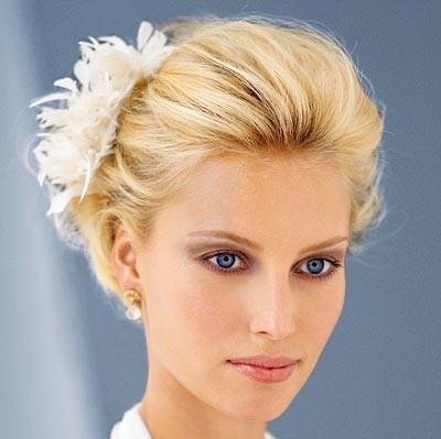 Elegant Wedding Updo Hairstyle with Decorative Feather