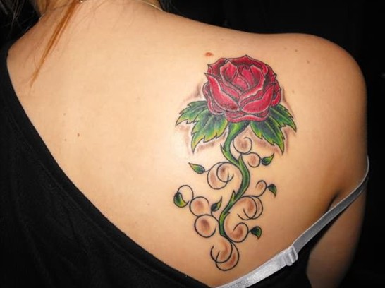 Rose tattoo on back shoulder