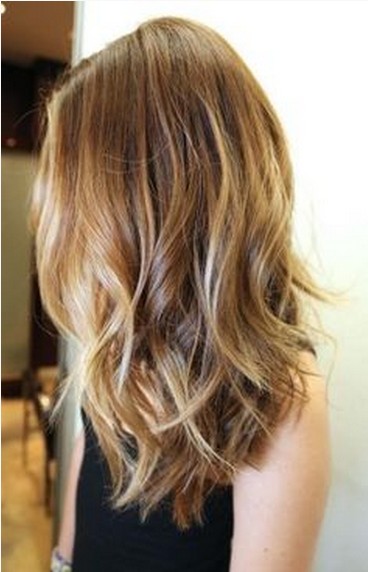 The Slightly Tousled Long Brown Wavy Hairstyle with Blond Highlights