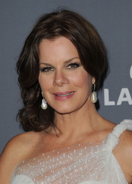 Marcia Gay Harden Low Bun and Pearl Earrings