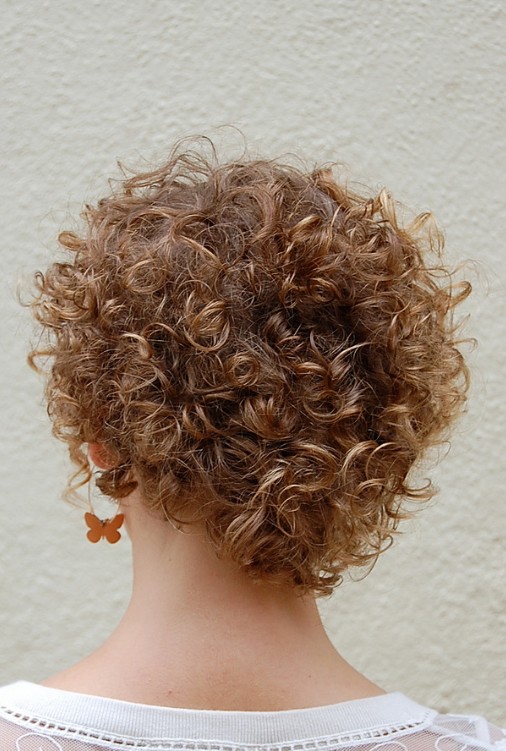 Cute Corkscrew Curls with V-shaped Nape Haircut.