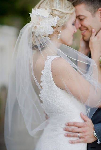 Glamorous Wedding Updo With Flower and Veil