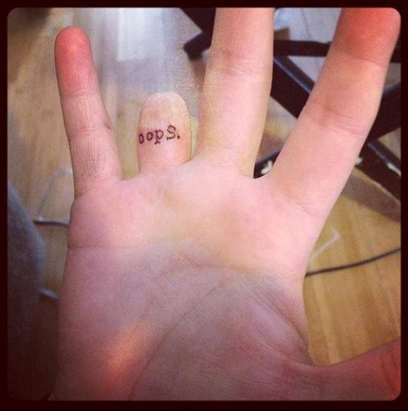 Interesting Tattoo On Finger