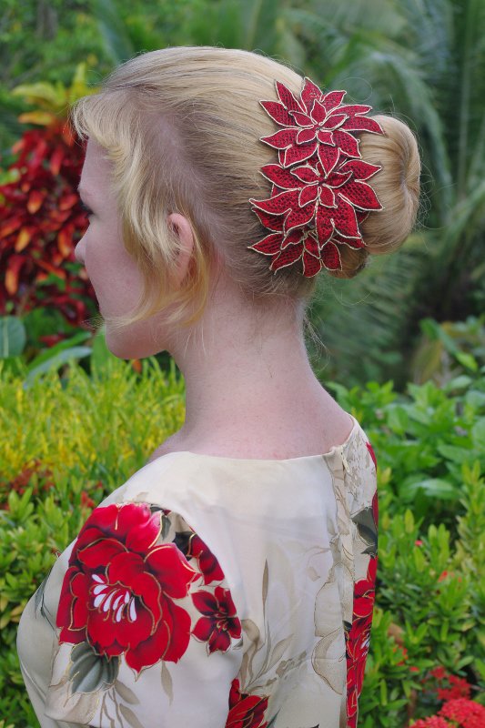 Simple Low Bun with Red Hair Accessory