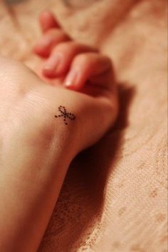 Tiny Bow Tattoo