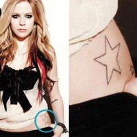 Avril Lavigne tattoos - star tattoos on hip
