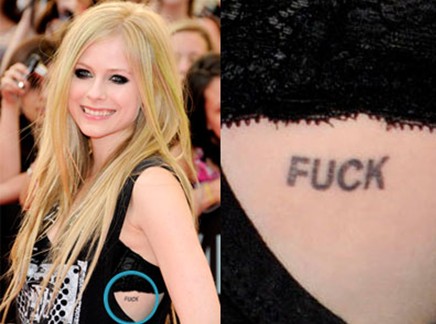 Avril Lavigne tattoos – ‘FUCK’ tattoo on her ribcage